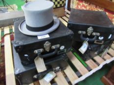 4 boxed grey top hats. Estimate £20-25.