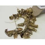 9ct gold charm bracelet with 32 charms, some hallmarked 9ct gold, total weight 94gms. Estimate £