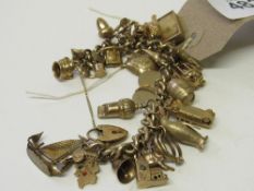 9ct gold charm bracelet with 32 charms, some hallmarked 9ct gold, total weight 94gms. Estimate £