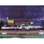 White metal clarinet in a Hawkes & Son case. Estimate £20-30.