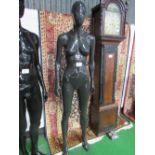 Pose-able female mannequin on glass stand. Estimate £20-40.