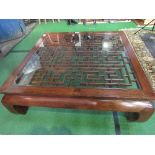 Chinese low table with bevel glass top, 1.3m x 1.3m. Estimate £60-80.