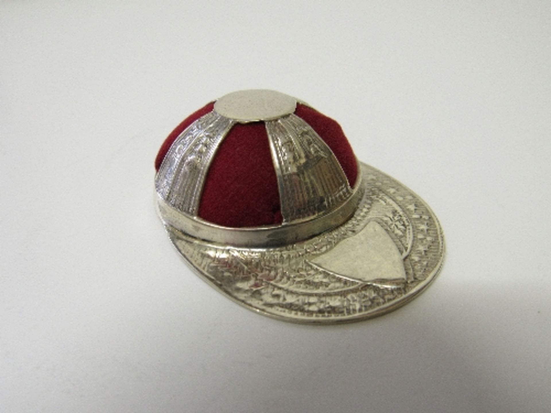925 sterling silver jockey's cap pin cushion. Estimate £30-40.
