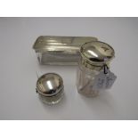 Rectangular glass dressing table pot with silver lid, Birmingham 1939; a small circular pot with