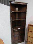 Ercol corner display unit. Estimate £20-30.