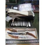 Qty of boxed cutlery, 6 pairs of leather evening gloves & 4 leather wallets. Estimate £20-40.