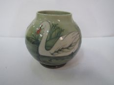 A Moorcroft pottery vase ‘Swan’ pattern, 250/350, artist David Tribe. Height – 17.5cms. Estimate £