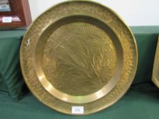 4 large brass trays. Estimate £30-40.