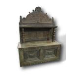 Large carved oak dresser with panelled back & shelf, supported by 2 carved figures, 160cms x 64cms x