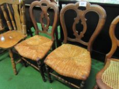 Pair of Victorian walnut serpentine back chairs with rush seats. Estimate £10-20.