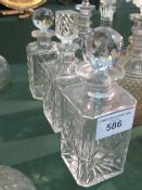 3 square cut glass decanters. Estimate £20-30.