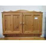 Pine hanging wall cupboard with interior shelf, 96.5cms x 13cms x 72cms. Estimate £20-30.