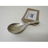 Silver scallop shaped tea caddy spoon by James Swan & Son, Birmingham 1929. Estimate £20-30.