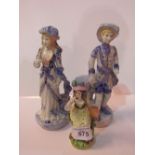 2 blue & white figurines & a female figurine with a bird. Estimate £15-20.