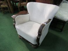 Antique mahogany carved show wood armchair in calico. Estimate £10-20.