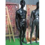 Pose-able male mannequin on glass stand. Estimate £20-40.