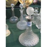 Ships cut glass decanter & 3 bulb-shaped decanters. Estimate £30-40.