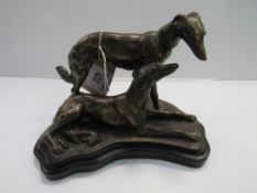 Metal model of a pair of Saluki on wooden plinth. Estimate £20-30.