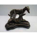 Metal model of a pair of Saluki on wooden plinth. Estimate £20-30.