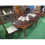 Mahogany circular wind-out extending table with leaves on pad feet to castors, 177cms (extended) x