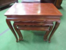 A nest of 3 mahogany tables. Estimate £20-40.