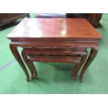 A nest of 3 mahogany tables. Estimate £20-40.