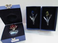 Swarovski bowl of tulips, blue tulip & yellow tulip. Estimate £35-45.