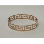 9ct rose gold bangle pierced with Greek key design. Hallmarked Chester in 1921 made by Henry