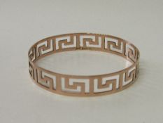 9ct rose gold bangle pierced with Greek key design. Hallmarked Chester in 1921 made by Henry