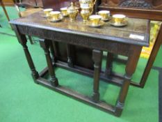 Oak occasional table with stretchers, 97cms x 38cms x 68cms. Estimate £30-50.