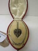 Early 20th century pendant necklace of coloured stones set in filigree silver coloured metal heart-