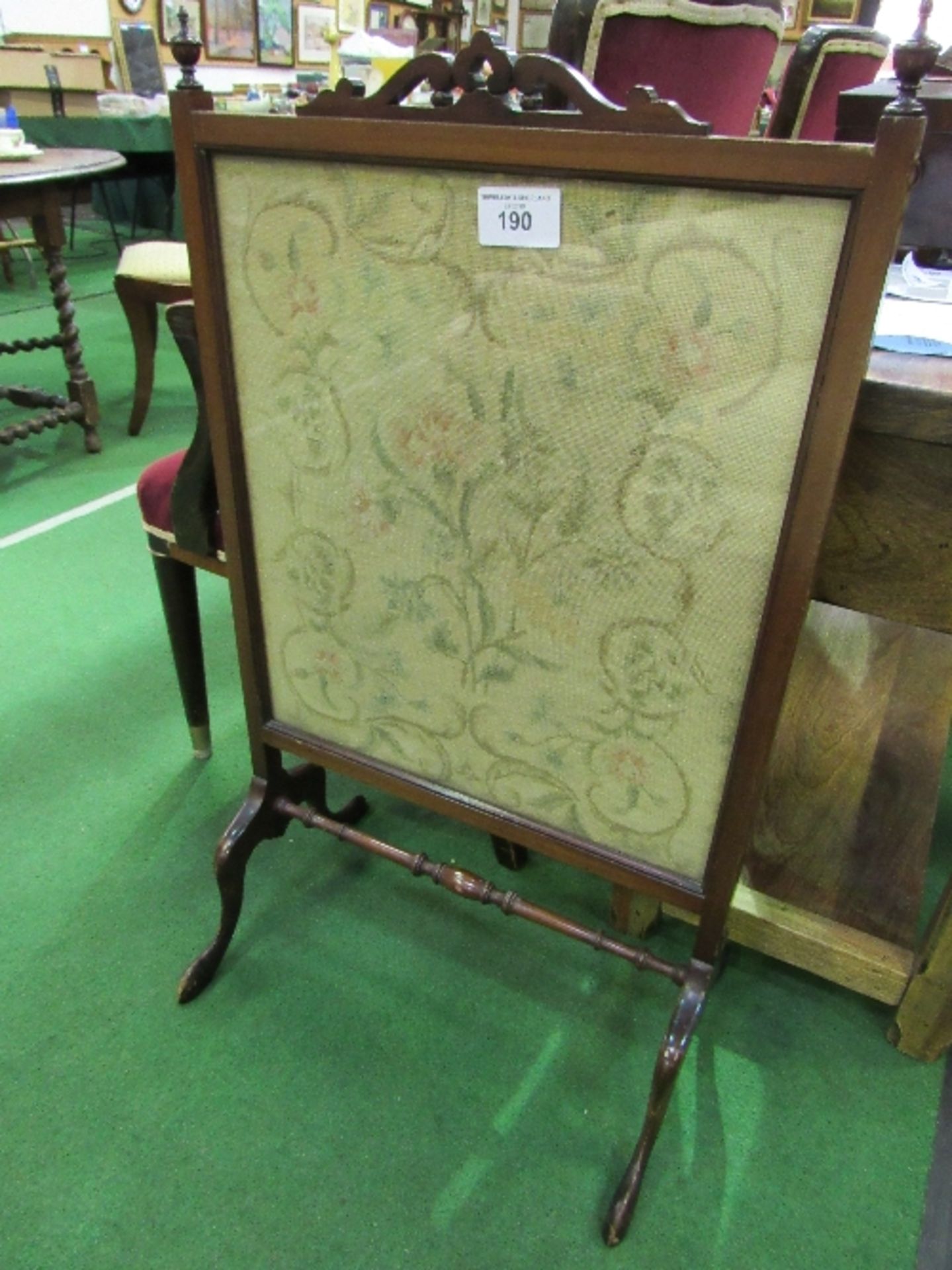 Mahogany tapestry fire screen, 58cms width x 98cms height. Estimate £20-30.