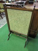 Mahogany tapestry fire screen, 58cms width x 98cms height. Estimate £20-30.