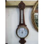 Decorative wall hanging aneroid barometer & thermometer (glass cracked). Estimate £20-40.