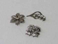 2 marcasite brooches & 925 hallmarked silver brooch. Estimate £40-60.