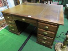 Large Partners' oak desk with leather skiver, drawers to one side & cupboards the other end,