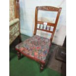 Nursing chair with carved rail & turned splat. Estimate £10-20.