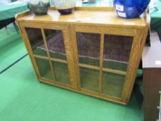 Oak cabinet with 4 panel glass doors. Estimate £10-20.