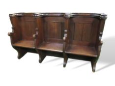 Oak triple seat pew with ornate Gothic tracery to rear, 188cms x 54cms x 110cms. Estimate £200-300.