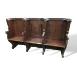 Oak triple seat pew with ornate Gothic tracery to rear, 188cms x 54cms x 110cms. Estimate £200-300.