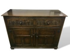 Oak sideboard with 2 drawer over cupboards, 127cms x 93cms x 51cms. Estimate £30-50.