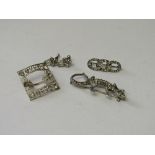 Silver buckle set with clear stones, silver hallmarked lizard brooch, pair of earrings & a