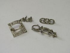 Silver buckle set with clear stones, silver hallmarked lizard brooch, pair of earrings & a