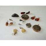 4 pairs of earrings, 3 lockets & 4 misc items. Estimate £10-20.
