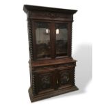 Magnificent Victorian carved oak library display cabinet with carved panels to the doors featuring