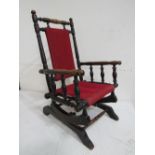 Child's turned oak rocking chair, 71cms high. Estimate £20-40.
