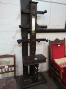 Oak ornately carved hall stand with glove box & narrow mirror, 190cms height. Estimate £20-40.