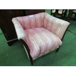 Regency sofa chair with tapering mahogany legs on square brass cup castors. Covered in a period