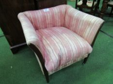 Regency sofa chair with tapering mahogany legs on square brass cup castors. Covered in a period