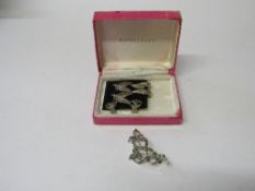 A marcasite brooch, 2 pairs of marcasite earrings & a pair of sterling silver earrings. Estimate £